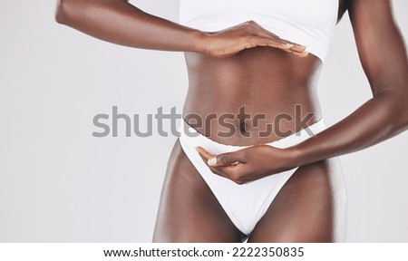 Hands, belly and health with woman in studio for detox, diet and gut wellness on white background with mockup closeup. Hand, black woman and stomach care by girl model healthy, lifestyle and balance