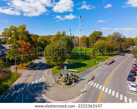 Lexington Minuteman Statue aerial view in fall on Lexington Common with First Parish Church, town of Lexington, Massachusetts MA, USA.  Royalty-Free Stock Photo #2222363147