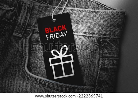Black Friday text on a black tag in jeans pocket