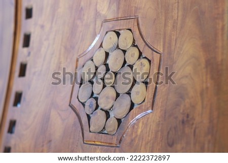 a close up of decorative detail on a wooden chair with a natural pattern. furniture photo concept.