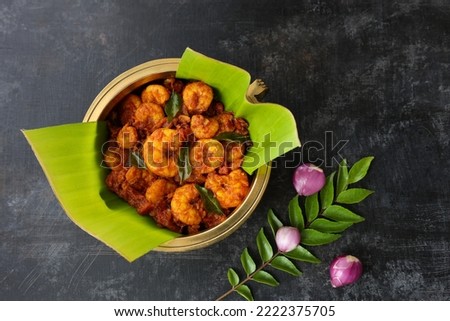 Spicy hot Prawn roast or shrimp fry. Masala fish curry served in with rice. Indian food Asian cuisine. Kerala fish curry also popular in South Indian Bengal Goa. Royalty-Free Stock Photo #2222375705