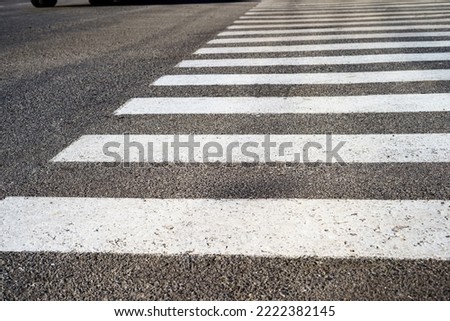 Crosswalk, safety on the road. Crosswalk on a small asphalt road.