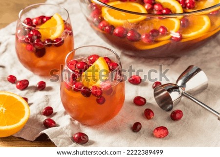 Boozy Refreshing Cranberry Christmas Punch with Champagne Orange and Rum Royalty-Free Stock Photo #2222389499