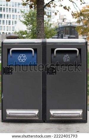 Recycling and trash cans in a public park