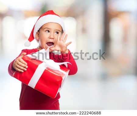 portrait of a surprised little boy with his gift