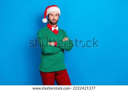 Portrait of calm focused person folded hands empty space isolated on blue color background