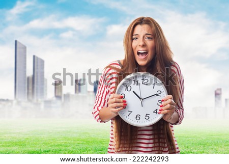 portrait of a pretty woman holding a clock
