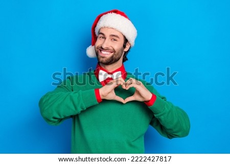 Photo of cheerful nice person arms fingers showing heart symbol toothy smile isolated on blue color background