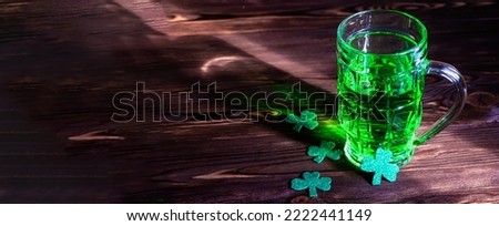 St. Patrick's Day. Green beer with clover leaves in an Irish pub. An entertainment event in the tradition of Ireland