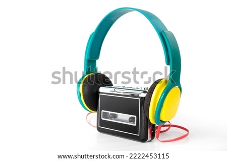 portable cassette walkman from the 90s with headphones, on isolated white background Royalty-Free Stock Photo #2222453115