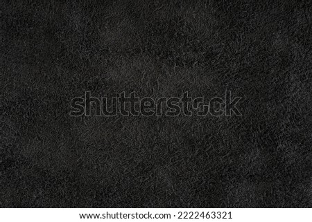 Black suede close-up. Natural black suede texture for design or project. Velvet, leather reverse. Royalty-Free Stock Photo #2222463321