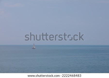 Sailboat on the blue sea