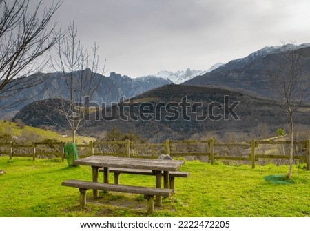 Picnic table in a picnic area overlooking the Naranjo de Bulnes (Pico Urriellu) in Asturias (Spain).