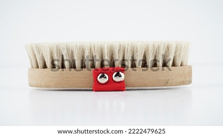 healthy massage brush made of natural wood on a white background