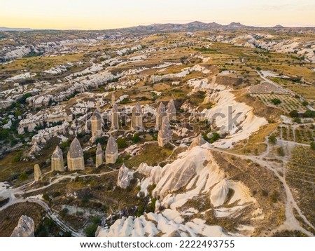 Magic fungous forms of sandstone, Love Valley between Avanos and Goreme road in Cappadocia, the Central Anatolia Region of Turkey. High quality photo Royalty-Free Stock Photo #2222493755