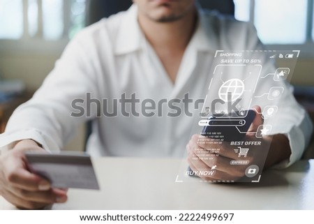 Businessman using smartphone and hand hold credit card pay web shopping on virtual screen during The promotion Black friday, Cyber monday. Shop for cheap products sale from website online stores.