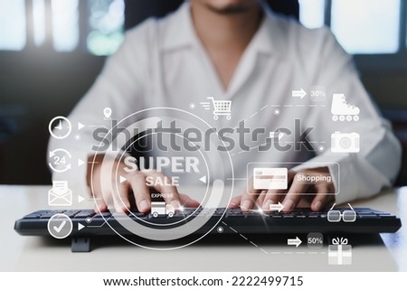 Man using keyboard shopping on virtual screen during the promotion Black friday, Cyber monday. Shop for cheap products from online stores. concept on virtual screen with hands typing on keyboard.