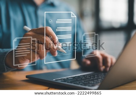 E-document management Paperless workplace, e-signing, electronic signature, document management man signs an electronic document on digital document by virtual notebook screen using a stylus pen.	