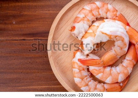 Cooked shrimps on wooden background, White Prawns on a wooden Background.