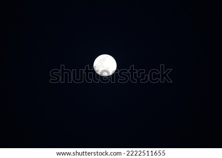 This is a picture of the moon rising at night.