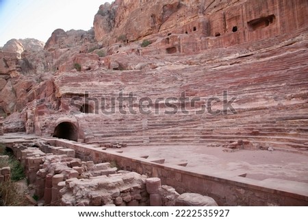 Petra, Jordan, November 2019 - A stone building that has a canyon with Petra in the background