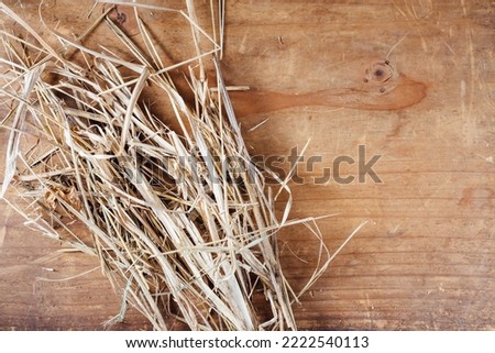 old straw on wooden background