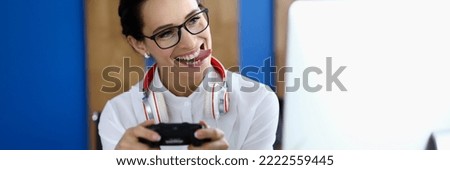 Joyful woman having fun with game console