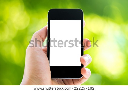 hand holding phone on nature background