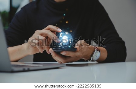 Businessman using smartphone with globe and currency, Money exchange, digital banking, interbank payment concept.