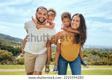 Happy mom, dad and children on piggyback ride from parents in nature park for fun, summer time bonding and outdoor family activity. Black father, mother and kids smile together while playing on grass