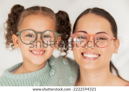 Portrait, mother and child with glasses for eye care wellness and healthy vision after an eye exam at the optometrist. Smile, mom and happy child wearing eyeglasses or eyewear with pride as a family Royalty-Free Stock Photo #2222594321
