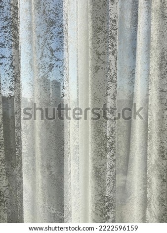 curtains, closeup detail of white curtains on window in a living room with city view in a sunny day. home interior decoration concept photo