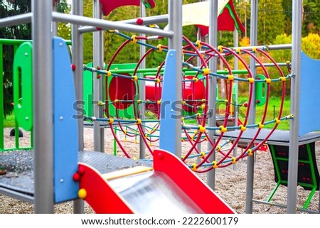 Colourful modern kids playground on the sunset. 