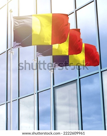 Flagpoles with the flag of Romania in front of the business center
