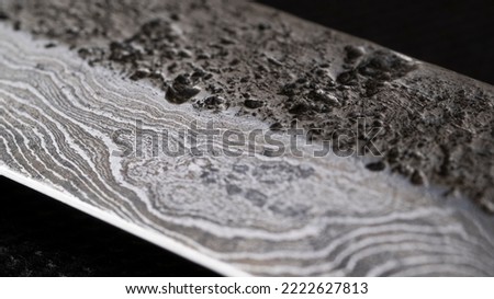 Background with a pattern of Damascus steel. Macro shot of damascus
knife texture. Damascus steel with original pattern. Damascus steel pattern. Royalty-Free Stock Photo #2222627813
