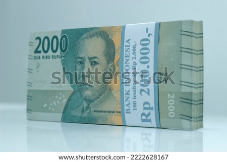 two thousand rupiah banknotes from Indonesia as a means of payment