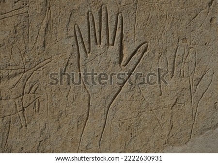 Tribal one Hand Sandstone Carving. Primitive Hand Carving. Native  Hand Petroglyph Royalty-Free Stock Photo #2222630931