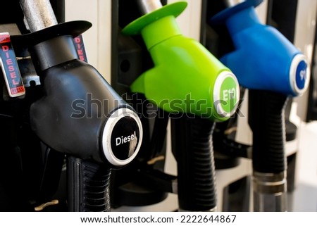 Various gasoline pumps on a gas station. Fuel nozzles oil dispensers. Petrol gas diesel fuel prices concept Royalty-Free Stock Photo #2222644867
