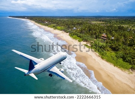 Plane landing at tropical resort, jet flies over ocean beach and rainforest. Aerial view of airplane, water and jungle coast in summer. Theme of travel, vacation, sea, trip, weekend and tourism. Royalty-Free Stock Photo #2222666315