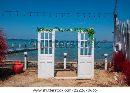 White door decoration by the sea for traveller to take portrait photo. Exterrior design