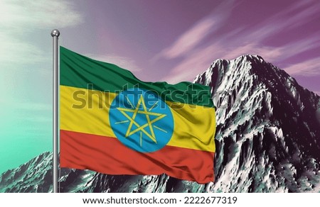 Ethiopia national flag cloth fabric waving on beautiful mountain background.