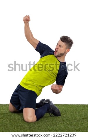 Professional soccer player with a yellow Ecuador national team jersey shouting with excitement for scoring a goal with an expression of challenge and happiness on a white background.