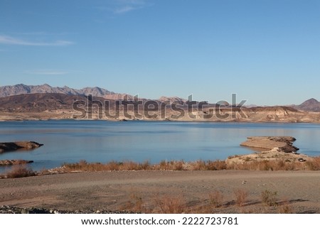 A picture of Lake Mead with the mountains in the back ground Royalty-Free Stock Photo #2222723781