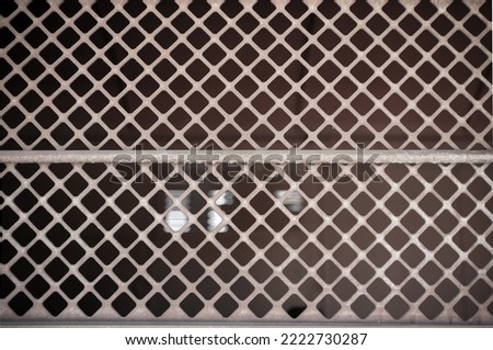 Prison interior. Window of a cell and jail, dark background Royalty-Free Stock Photo #2222730287