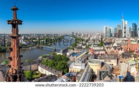 The city center of Frankfurt am Main with the skyscrapers of the banking district, the historic old town and the river Main under a cloudless sky and beautiful weather