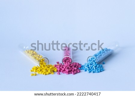 Granular paint. Colored granular pigments for plastic. Royalty-Free Stock Photo #2222740417
