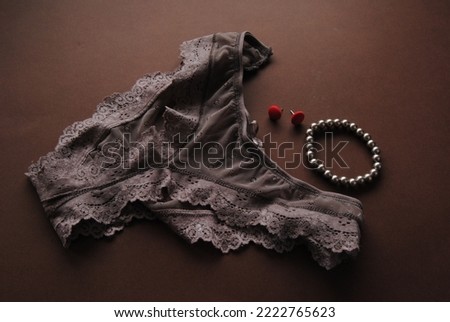 Women's accessories on brown background