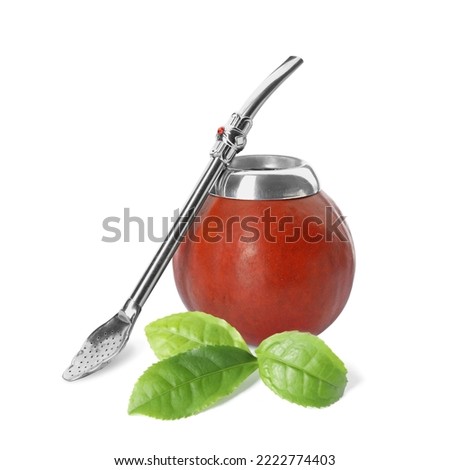 Calabash with mate tea, bombilla and green leaves on white background Royalty-Free Stock Photo #2222774403