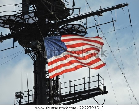 american flag on a warship waving in the wind Royalty-Free Stock Photo #2222793515