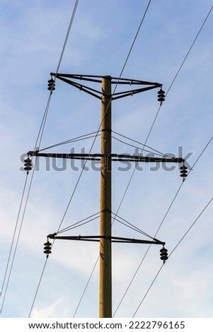 power line poles on a blue sky background